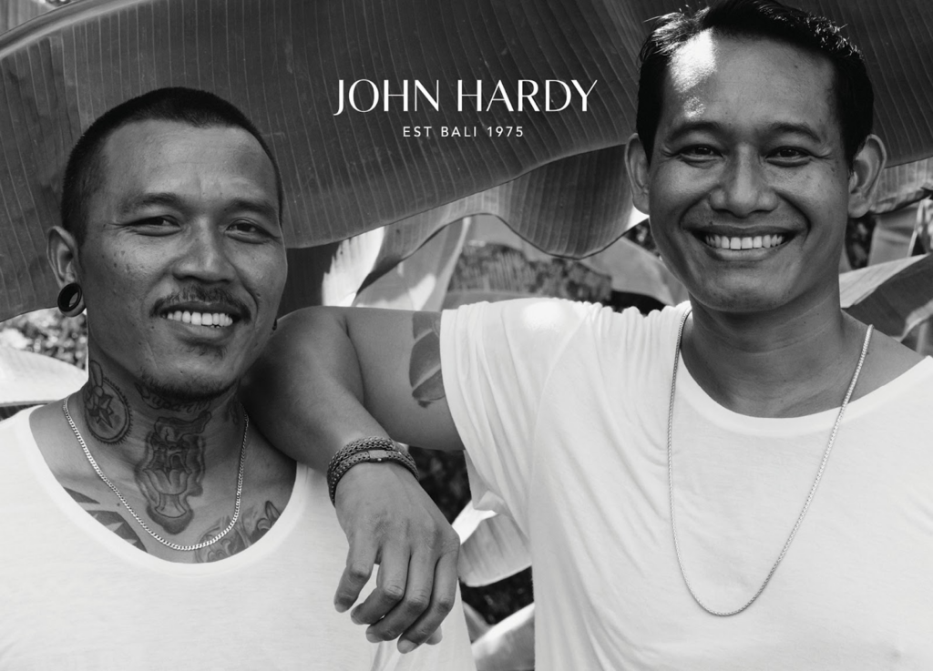 two men with jewelry father and son on postcard advertising